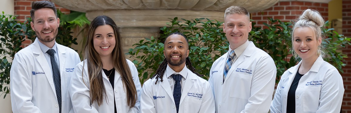 PGY-4 class photo with five individuals in a line