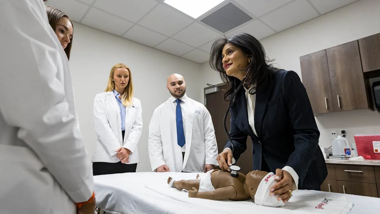 Associate Dean Caroline Paul teaching Bowling Green campus med students in the simulation lab