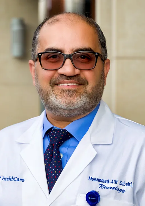 Headshot of Dr. Zubairi in labcoat