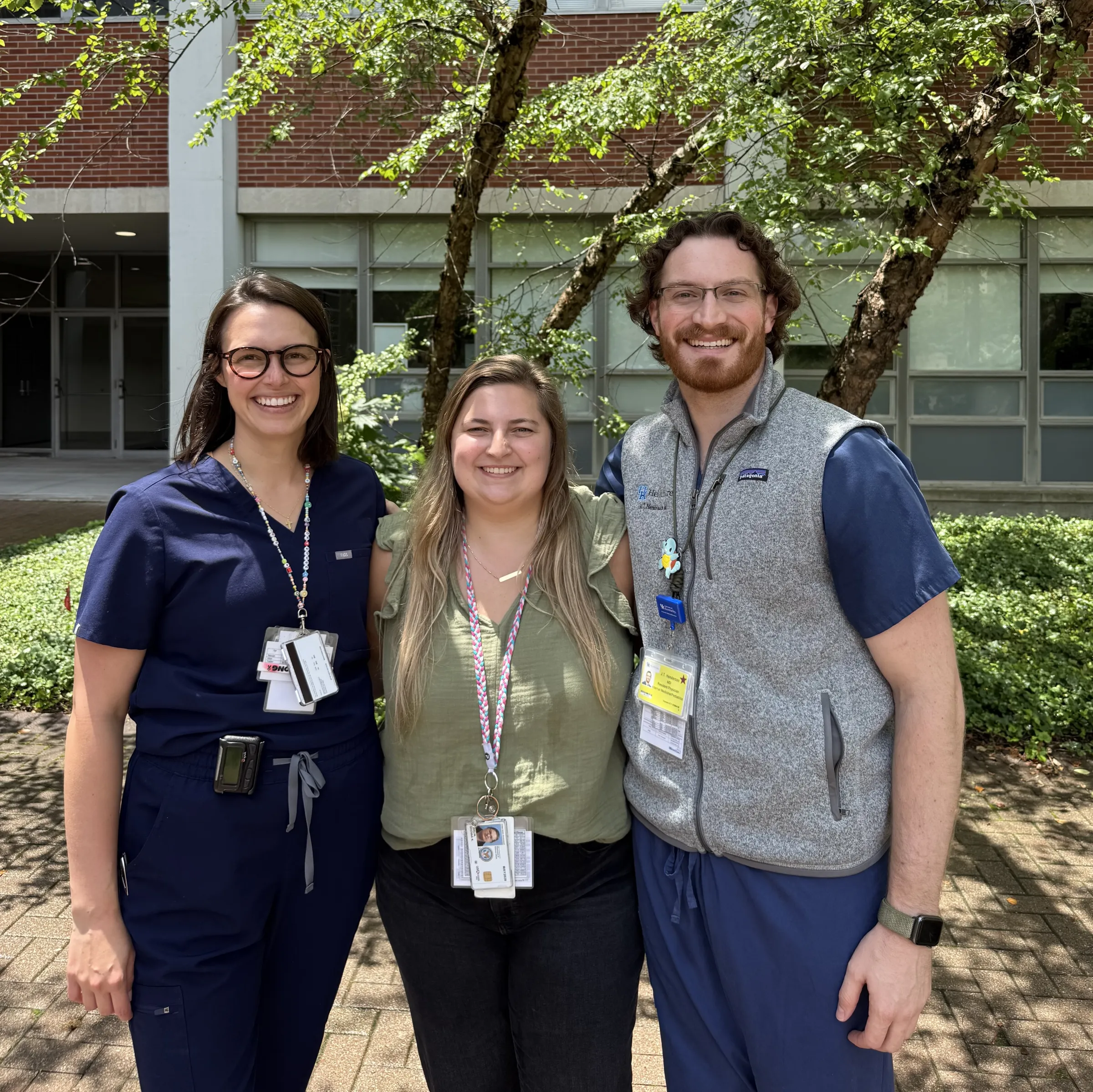 2025 Med-Ped chiefs standing outside in a UK courtyard.