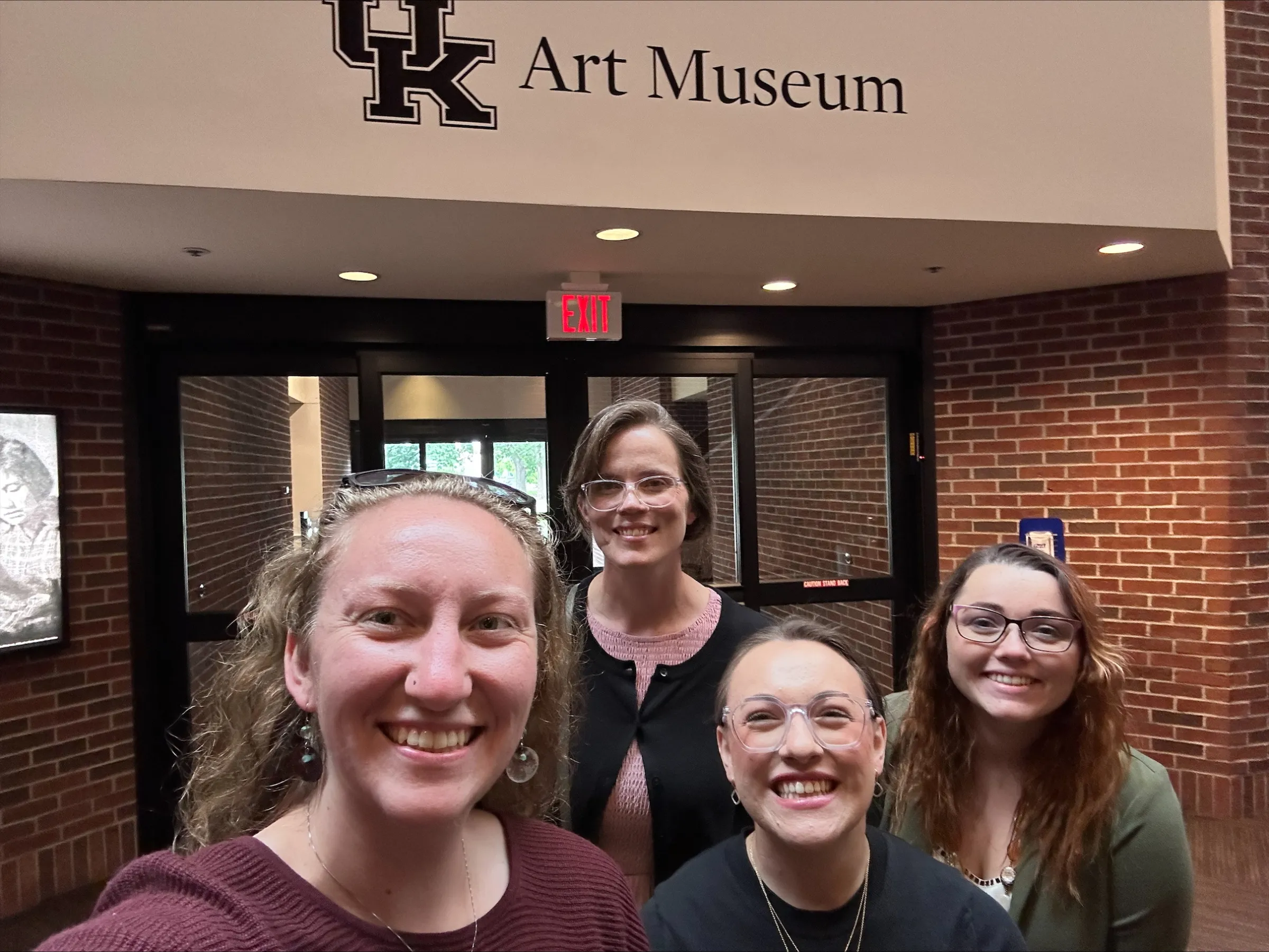 Women smiling in front of Art Museum Entrance