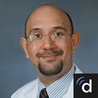 Ketan Buch, in white coat.