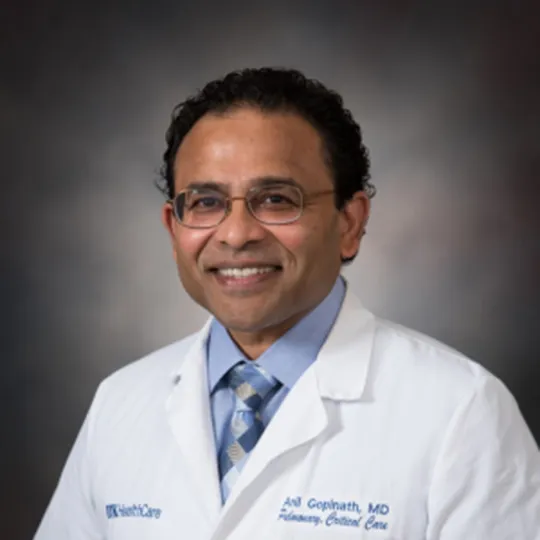 Anil Gopinath in white coat.