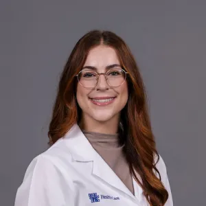 headshot of lumm in whitecoat