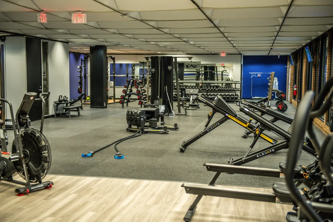 Gym facility with cardio machines and free weights