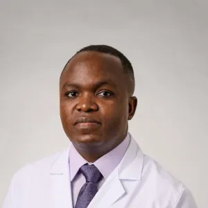 headshot of dr. mirembo in white coat
