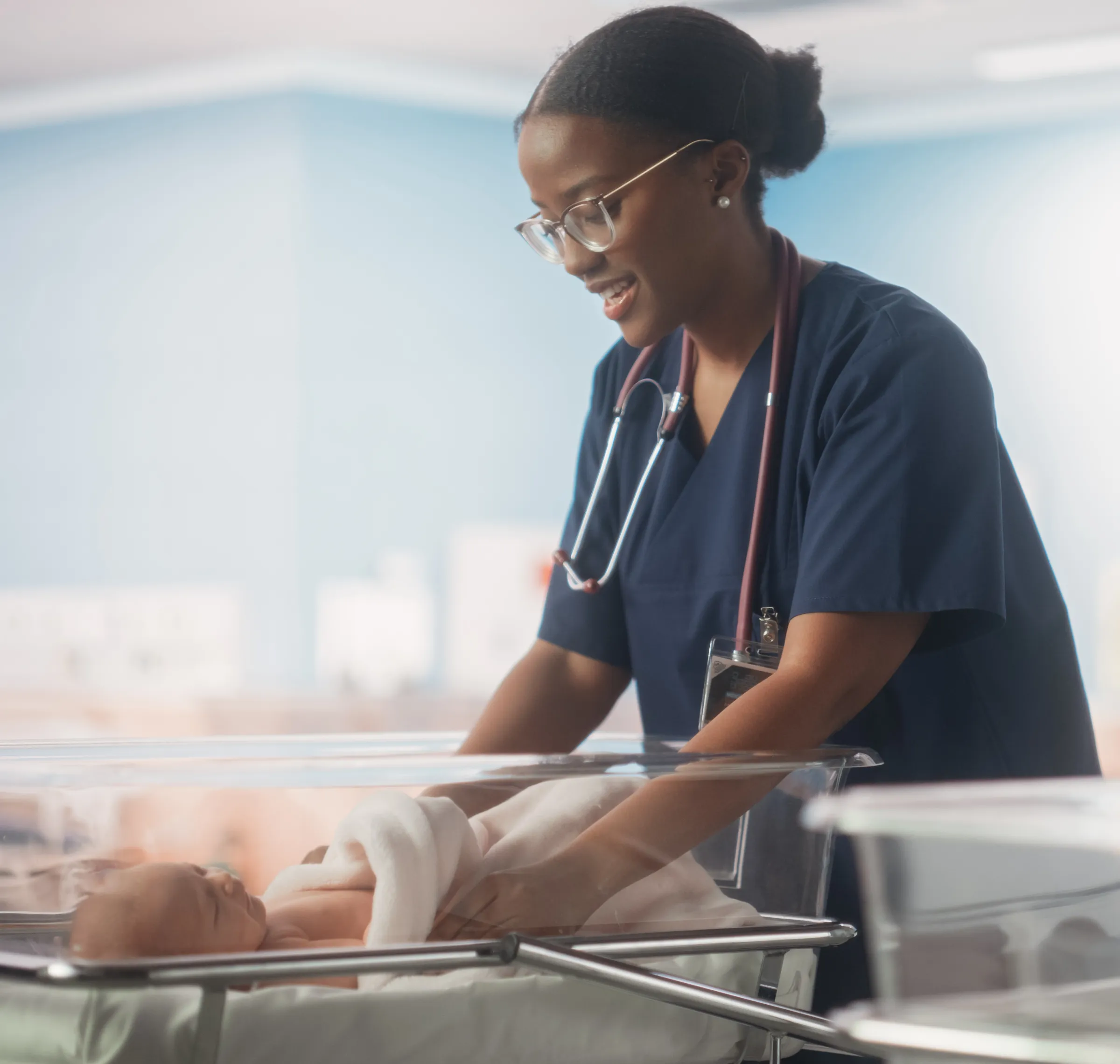 provider caring for a newborn in a newborn unit