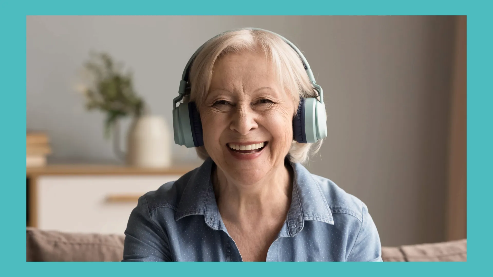 An elderly woman is listening to music through headphones. 