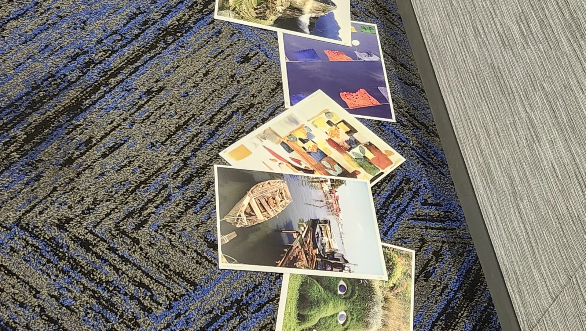 Large images on the floor ready to be selected for discussion