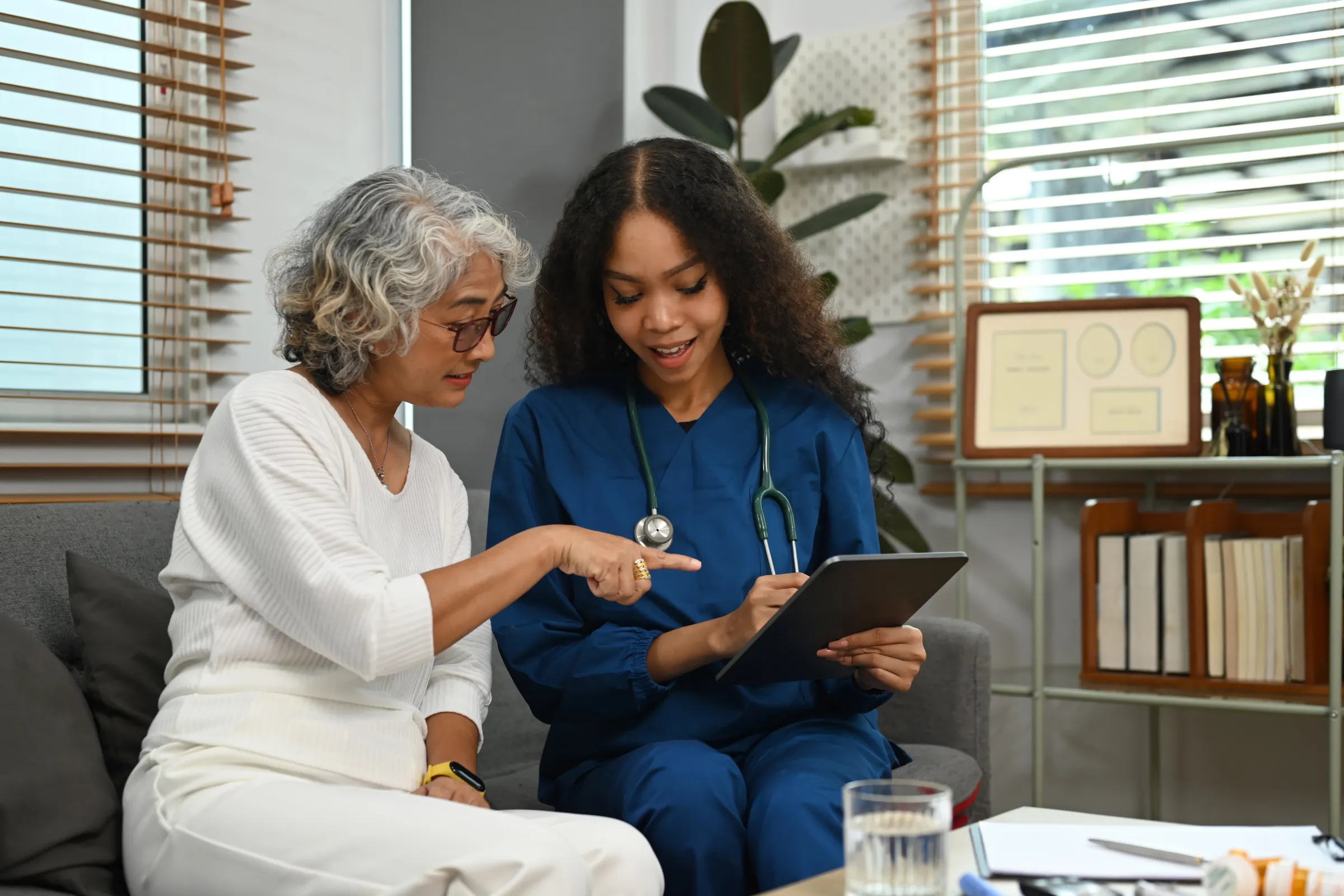 Nurse discussing caregiving options with a patient's spouse. 