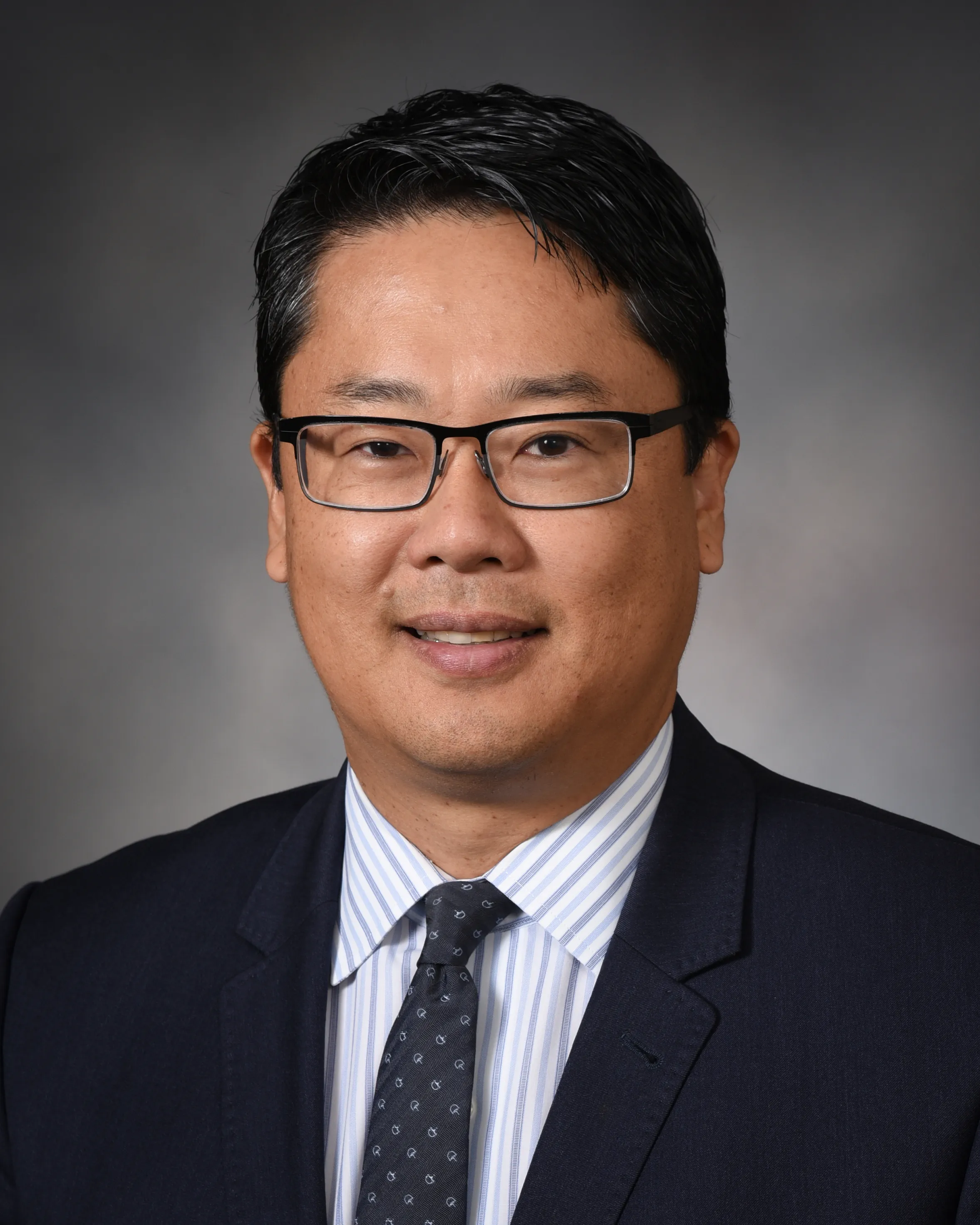 Joseph Kim, MD in suit coat and tie
