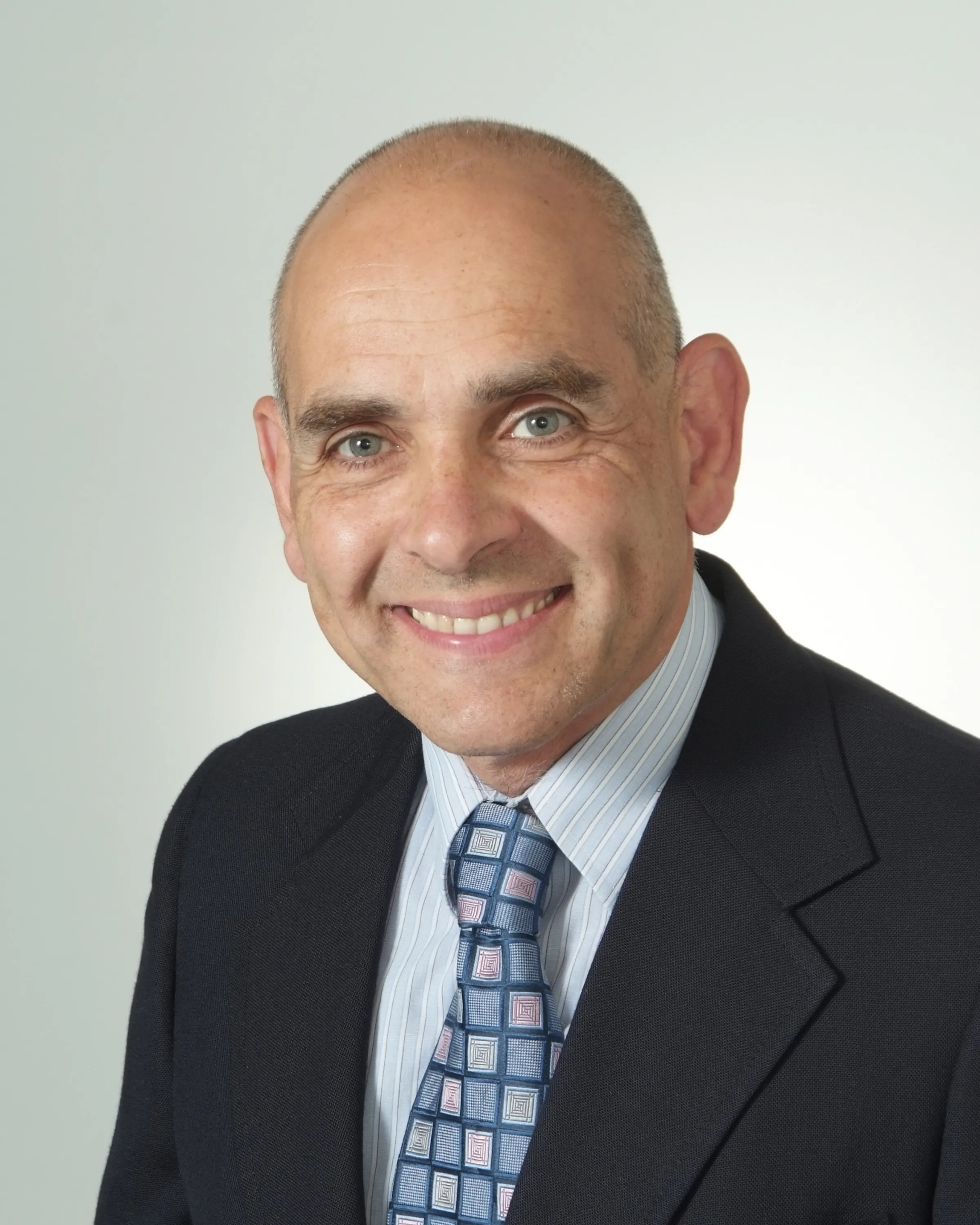 Portrait photo of Dr. Eleftherios Xenos in suit coat and tie