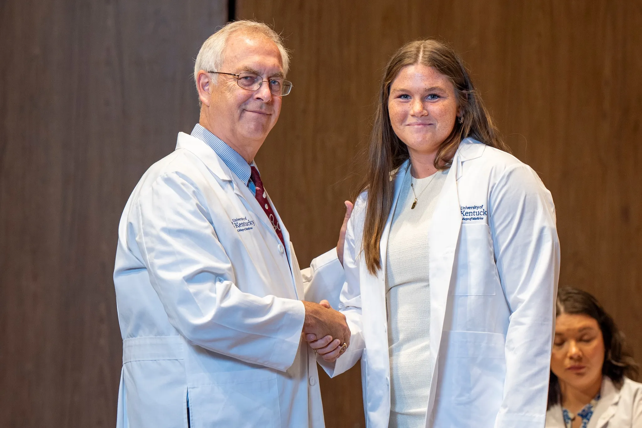 Hannah shaking hands with Dean Griffith