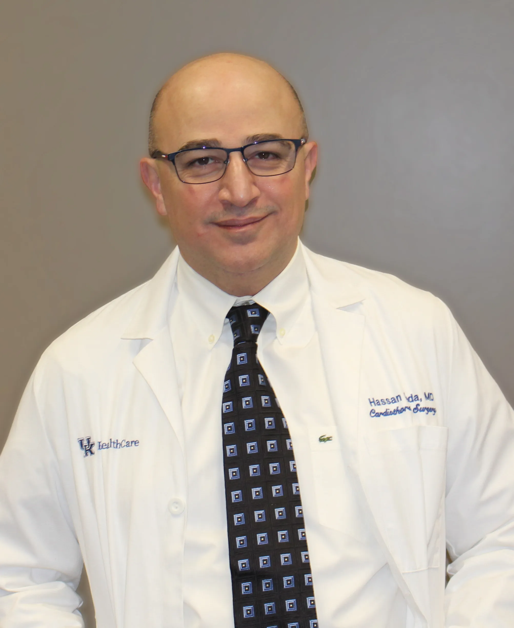 Doctor Hassan Reda portrait in a physician's white coat and tie