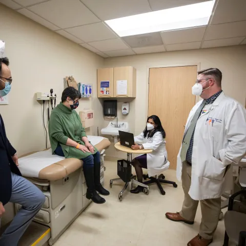 group of providers in an examination room