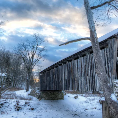 Photo of covered bridge in the snow