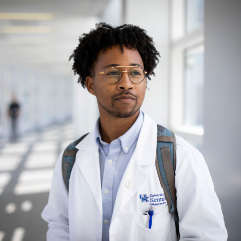 Portrait photo of a UK medical student in their white coat