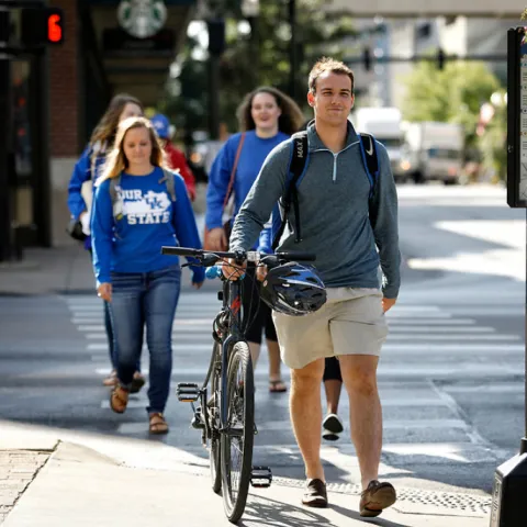 pedestrians and bicycle in crosswalk in downtown Lexington