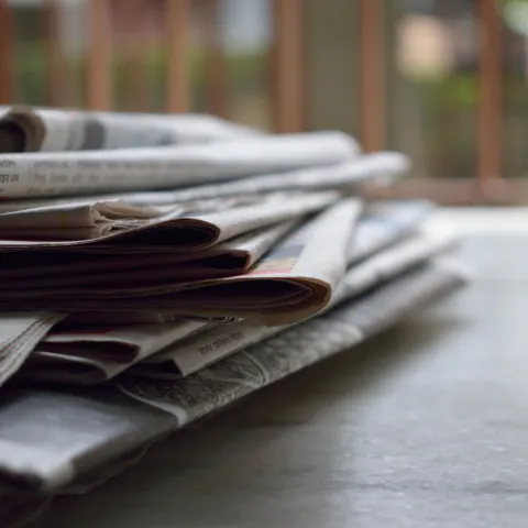 Stacked newspapers
