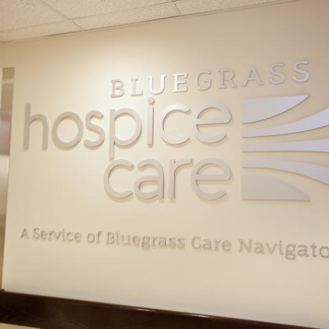 bluegrass care navigators logo on the wall of a hospital hallway