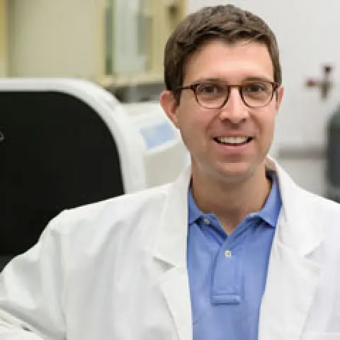 a headshot style photo of Dr. John R. Lukens 