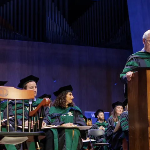 dean griffith addressing graduates from a podium
