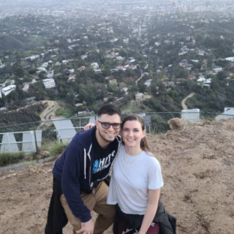 Gabrielle Morguelan and spouse at the Hollywood sign