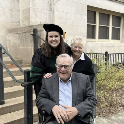 Alexa Alfred and her grandparents at her doctorate graduation