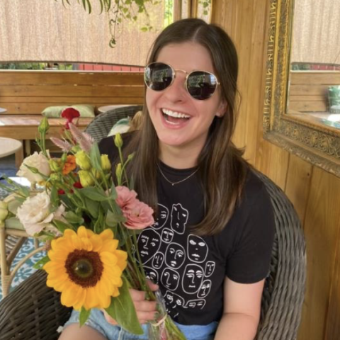Hallie Walther holding a bouquet of flowers