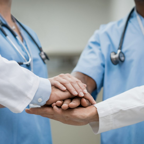 Doctors joining hands