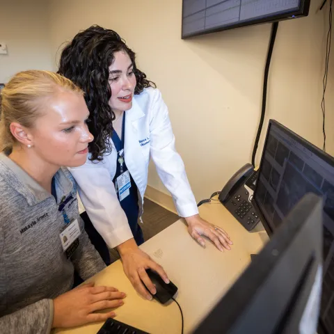 Obgyn resident and 4th year medical student working together