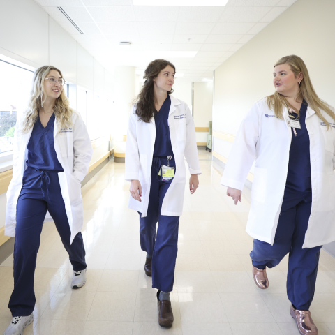 UK HealthCare OBGYN residents walking in hallway 