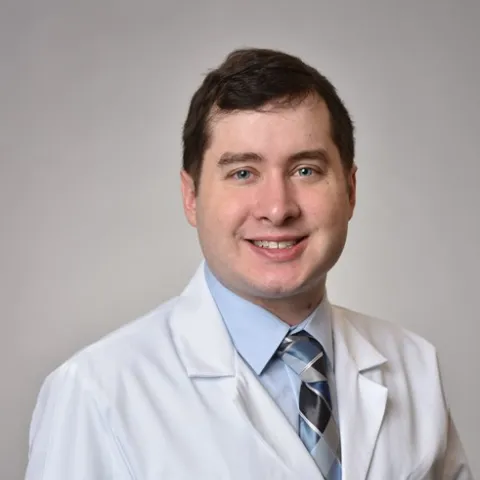 Male provider in white coat