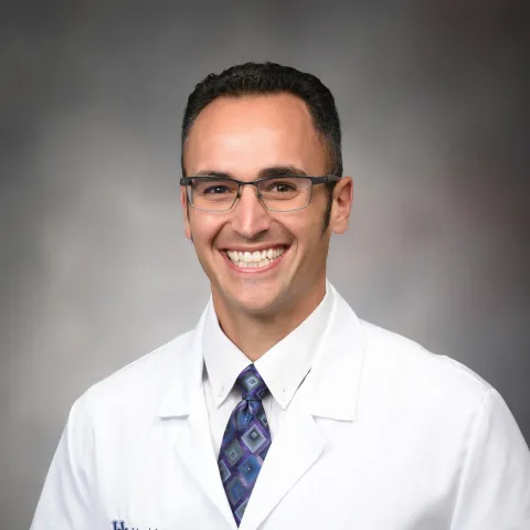 Male provider in white coat