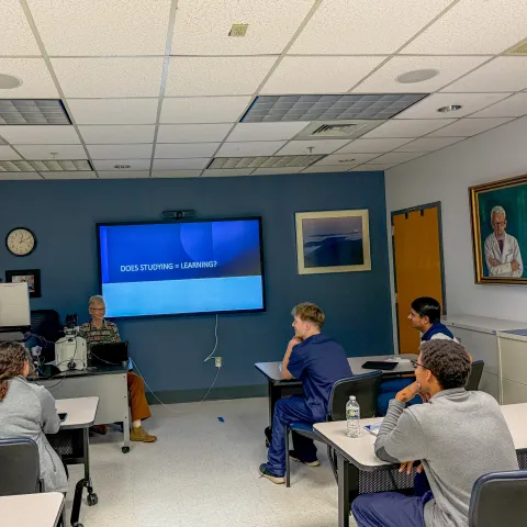 Dr. Bocklage teaching the resident about adult learning techniques.