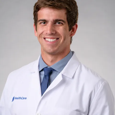 zach tarter smiling in his white coat