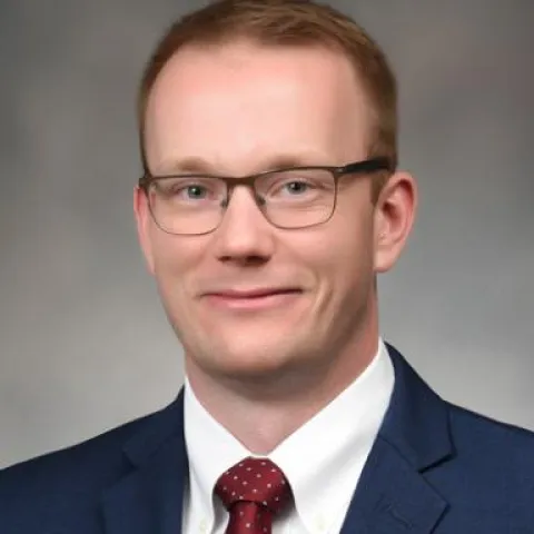 Garrett Oberst smiling for his headshot