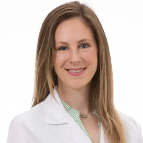 Dr. Lauren Bojarski smiling against a white backdrop. 