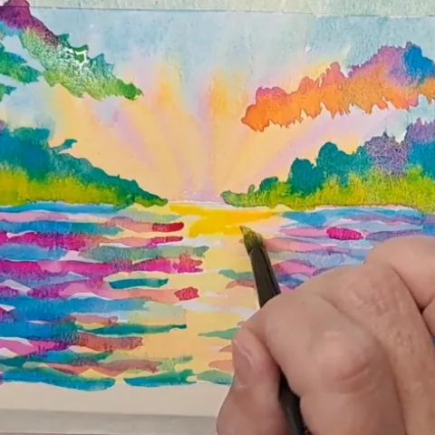 Painting a watercolor sunset. 