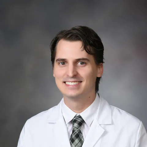 Male provider in white coat