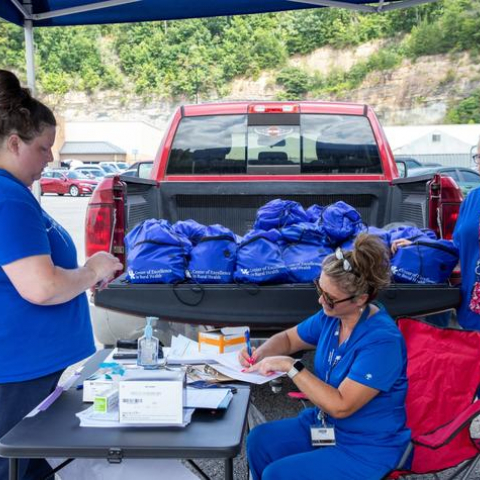 UK HealthCare's mobile care unit in Hazard, Kentucky, is offering basic wound care and vaccinations. Team members are also handing out backpacks with supplies for flood survivors.