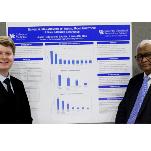 Justin Hudnall and Dr. Sibu Saha at the research poster presentation