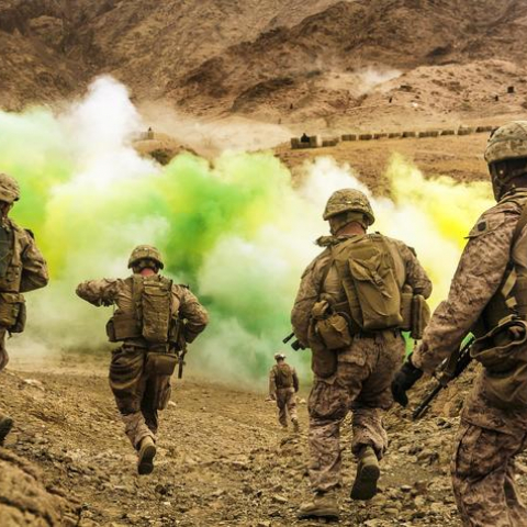 U.S. Marines run to firing positions during live-fire training in Jordan....JPG