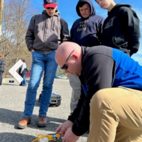 Craig Wilmhoff and students preparing their drone for the citizen science project in Perry County.
