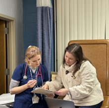 Dr. Schaeffner reviewing chart with volunteer 