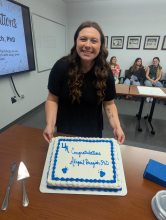 Dr. Dragich displays her congratulatory cake.