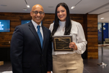 Dr. Pandalai awards Krista Spear the Frances Massie, MD Award.
