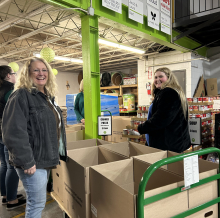 volunteers pack boxes at Go Pantry 
