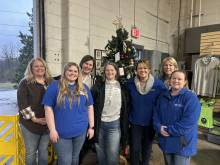 volunteers pose at GoPantry warehouse