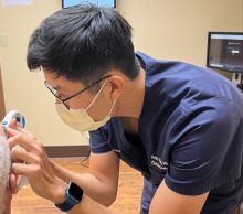 UK GO resident helps a patient